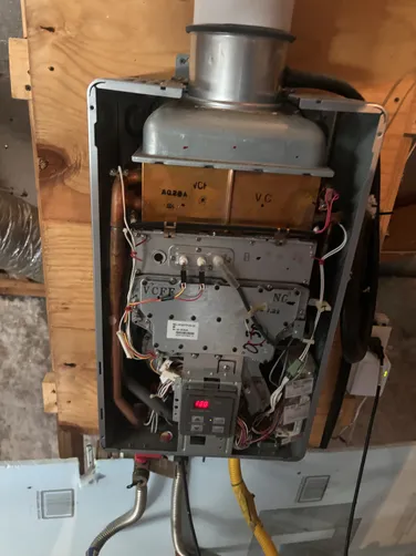 photo at undefined, TX on Sep 30, 2025: The Rinnai tankless water heater was experiencing issues with its ignitor rod, causing inconsistent