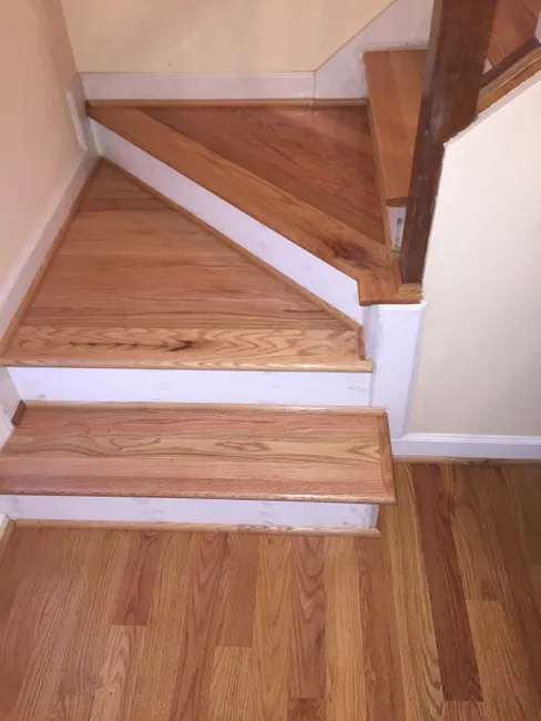 Transformed this home's look by installing gorgeous oak treads and refinishing all hardwood floors beautifully.
