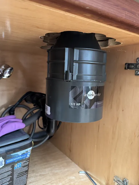 An outdated garbage disposal was replaced with a new, efficient model, restoring kitchen functionality and convenience.