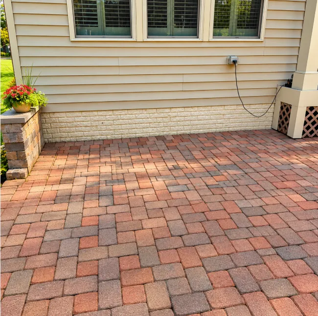 A compromised patio led us to restructure the base and reinstall pavers, enhancing safety and beauty.