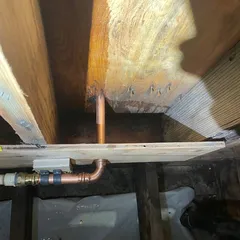 photo at Martinez, CA on Dec 27, 2024: A hot water line leak was discovered behind a wall, prompting a contractor to expose the piping for