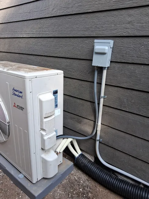 To enhance HVAC efficiency, we relocated a mini split condenser, optimizing airflow for a comfortable home.