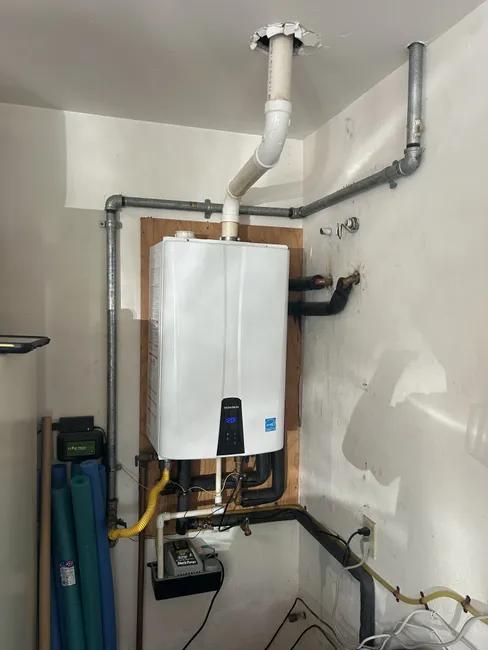 A tankless water heater at a residential home underwent urgent maintenance, restoring reliable hot water through a descaling flush and thorough inspection.