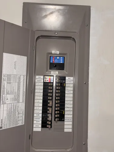 Relocated 2 20A Circuit breakers & Installed a new Surge protector closest to the incoming power on this 200A Main Eaton CH panel.