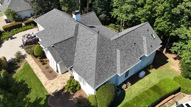 After significant roof wear was identified, we replaced it with Owens Corning Duration shingles in Williamsburg Gray. Sam's home is now both stylish and protected from the elements.
