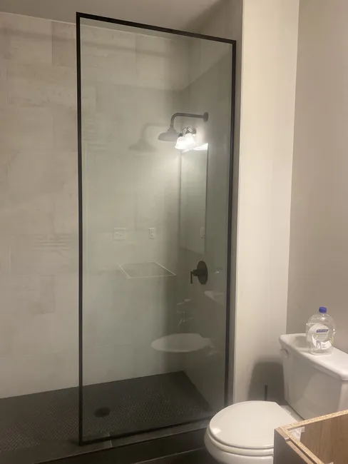 Two different glass enclosure with fix screen on both, one is frameless the other is wrapped with metal trim to give it a modern flair