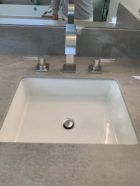Upgrading the outdated lavatory faucet, we installed a modern replacement that enhances efficiency and style.