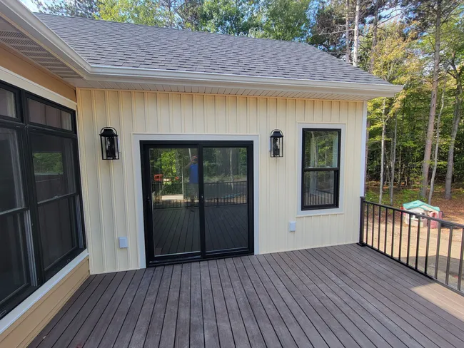 We reimagined the backyard with a stunning four seasons room and a beautiful deck, perfect for year-round enjoyment.