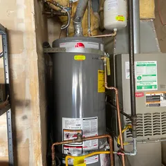photo at Martinez, CA on Nov 27, 2025: A leaking water heater can lead to significant issues, so we replaced the old unit with a new Rheem