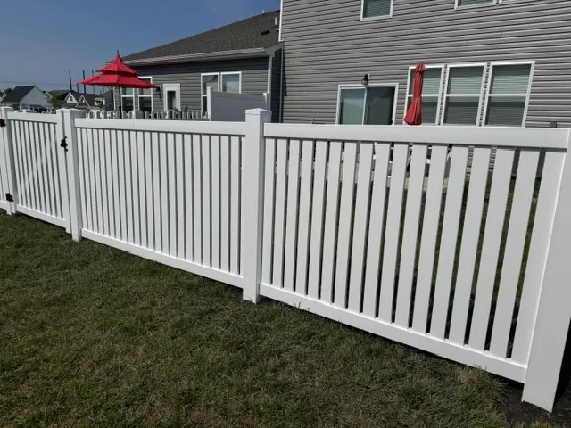 A Cape Charles-style vinyl picket fence was expertly installed, enhancing both security and curb appeal for this home.