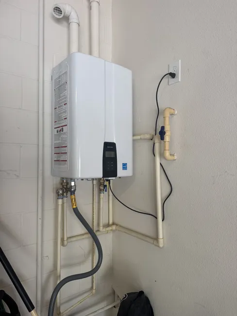 We customized an electrical upgrade by relocating a receptacle closer to the new tankless water heater, enhancing convenience for the homeowner.