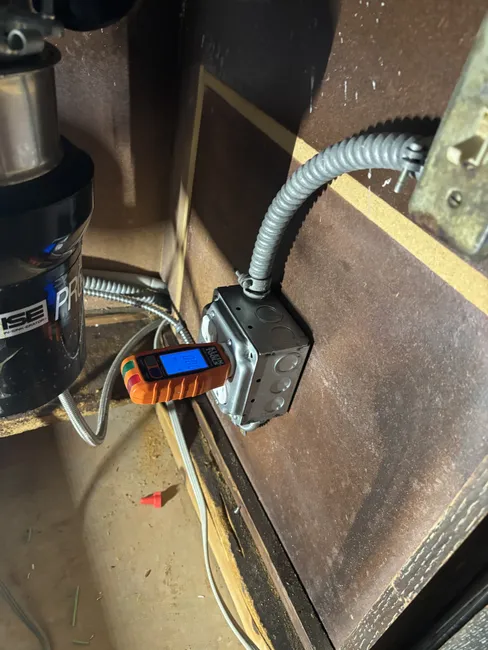 We optimized the power delivery system under the kitchen sink, ensuring seamless operation for the dishwasher and disposal.