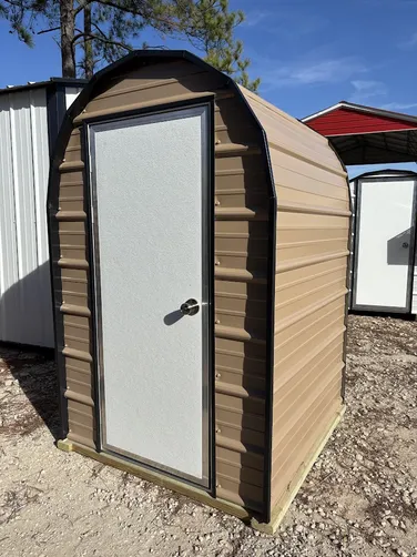 photo at Canton, TX on Jan 12, 2026: 4x4 well shed with man door-no floor-welded frame-treated base - tan with black trimpicked up from