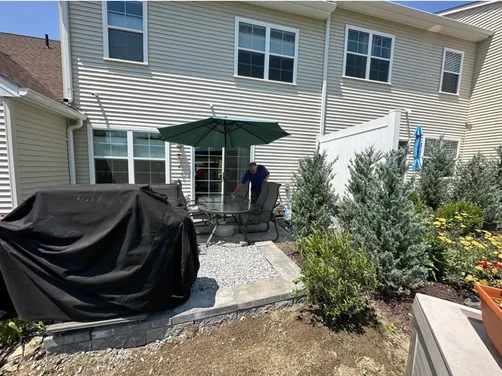 photo at Hyde Park, NY on Jul 07, 2023: To enhance the outdoor space, we created a small hardscaped wall that beautifully backs the patio, 