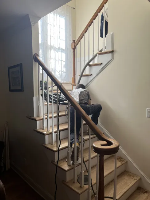 A stunning transformation of hardwood floors and staircase with Bona Traffic finish, enhancing the home's beauty and durability.