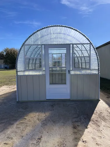 photo at Mabank, TX on Dec 11, 2025: 10x12 Deluxe greenhouse with Lightstone wainscotFiberglass top, metal sides, welded frameTreated 