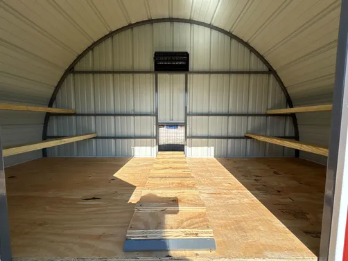 photo at Canton, TX on Jan 12, 2026: 10x12 chicken coop in burnished slate with black trimwheels, loft, roosting bars, vents, roll out 