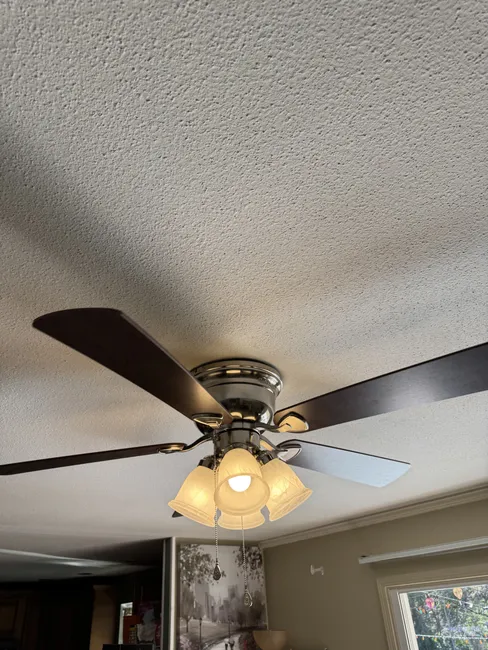 We refreshed the dining room by removing the old fan and installing a stylish new model, enhancing comfort and aesthetics.