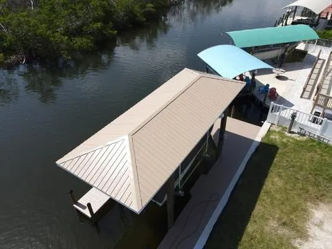 We upgraded the boathouse with a durable metal roof, enhancing both its resilience and visual appeal.