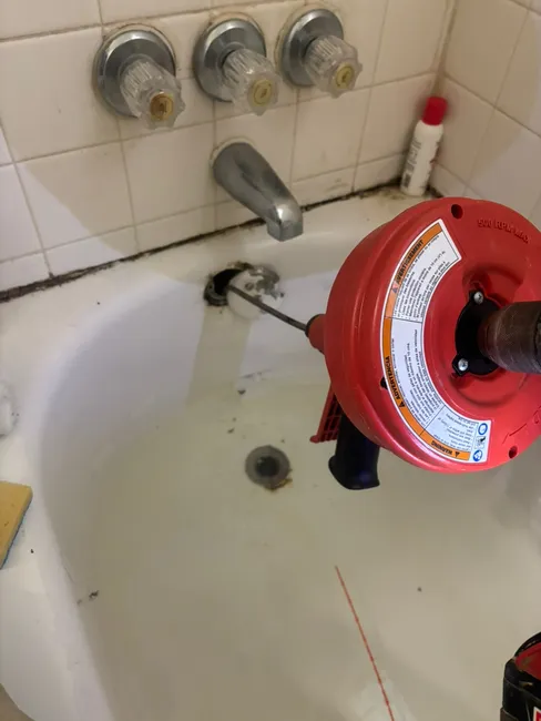 A significant hair clump was clogging the drain. We used a drill auger to restore smooth flow efficiently.