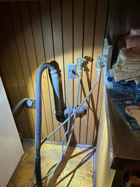 We tackled a recurring laundry drain issue by clearing blockages with a drill auger, ensuring optimal flow.