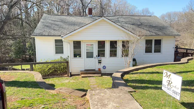 In Fort Mill, we replaced the roof's back half, restoring safety and value after tree damage.