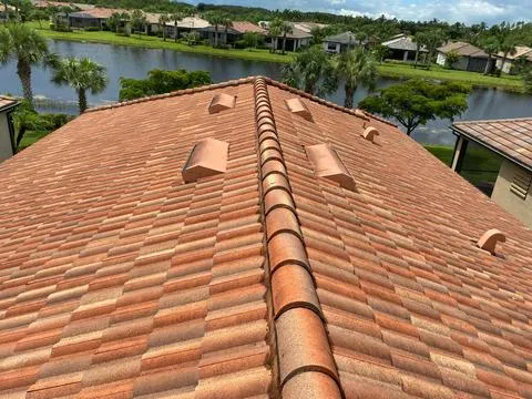 A stained ceiling led us to uncover a roof leak. We replaced damaged decking and reinstalled tiles for a lasting repair.