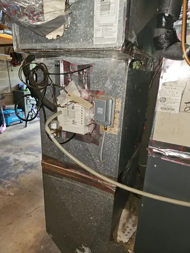 Indoor HVAC equipment inspected during a Mountain Brook cooling service visit