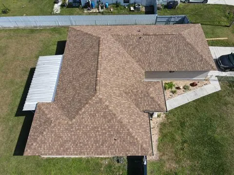 Storm damage compromised this residential roof. We replaced the damaged sections with high-quality shingles, enhancing both protection and curb appeal.