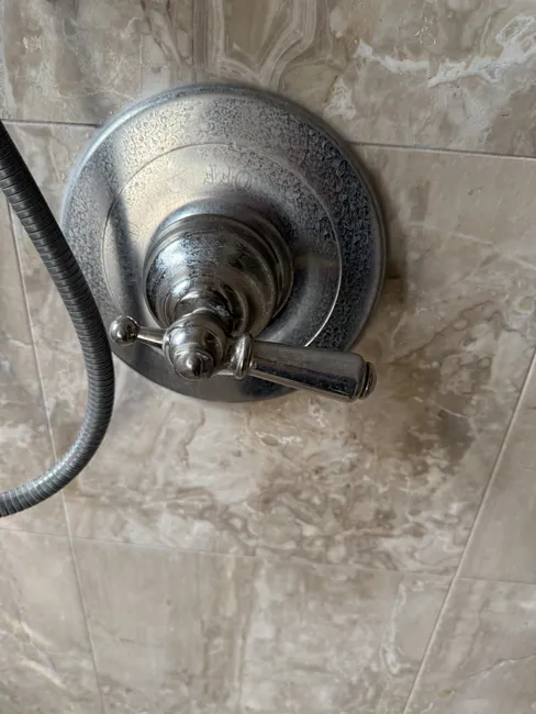 Investigating a leak revealed compromised tile and grout, allowing moisture to damage surrounding areas.