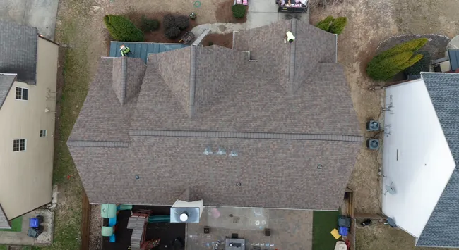 After identifying significant roof damage, we replaced it with Owens Corning Duration shingles in Teak, enhancing both protection and curb appeal for Marcus's home.