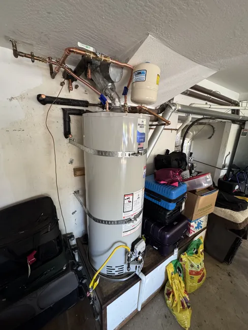 When the old 50-gallon water heater began leaking, we replaced it with a new unit, restoring comfort and hot water flow.