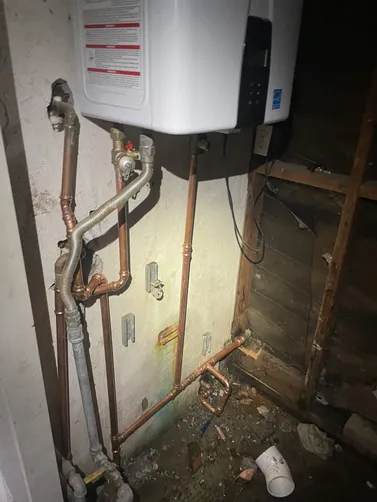 photo at Walnut Creek, CA on Apr 21, 2026: A water line leak was identified at the T&P valve on the tankless water heater, causing potential d