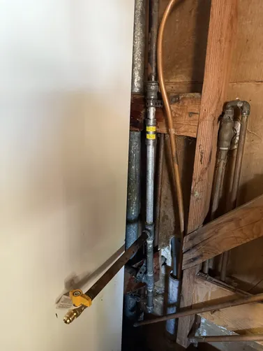 photo at a Cerrada Alamo, CA on Nov 27, 2025: A gas line leak was detected behind the water heater, posing a safety risk. We promptly repaired th