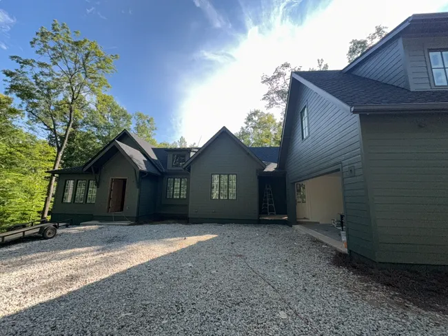 Updated rainwater management was achieved with new 6-inch seamless gutters and downspouts in stylish dark bronze.