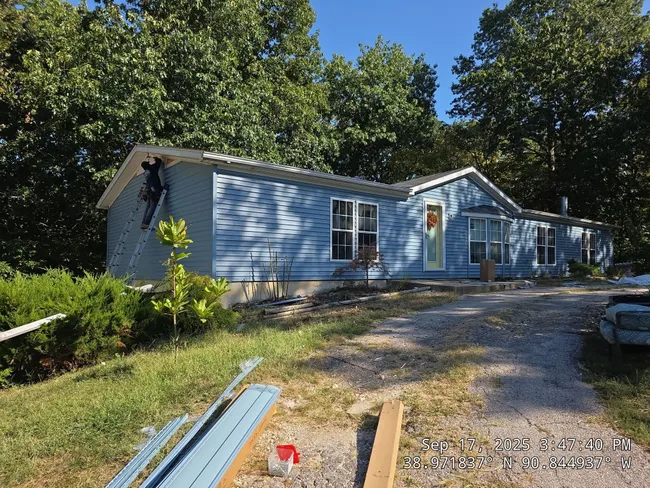 Old siding detracted from this home’s charm. We refreshed it with durable vinyl, enhancing its Market Square look.