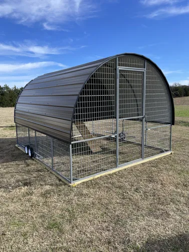 photo at Canton, TX on Jan 12, 2026: 10x12 chicken coop in burnished slate with black trimwheels, loft, roosting bars, vents, roll out 