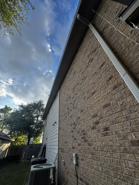 Seamless aluminum gutter installation in Leander Texas