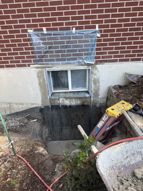 We cut out two egress windows, enhancing safety and bringing natural light into the home.
