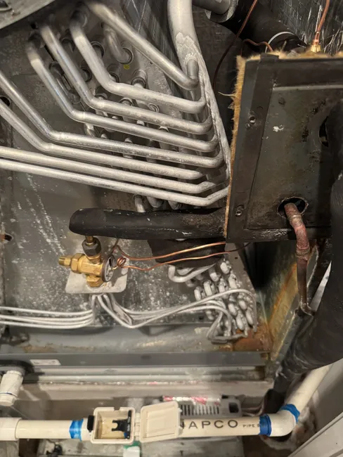 Restored optimal performance to a residential central AC by replacing the faulty TXV and recharging the system.