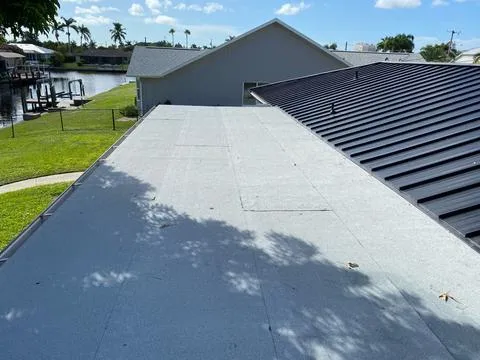 Significant leaks in the old flat roof led to a complete replacement. We installed a new 2-ply modified bitumen system for lasting protection and enhanced durability.