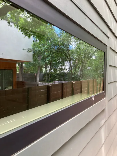 Restoring a home's exterior, we meticulously washed the walls, detailed the windows, and cleaned the gutters, enhancing its curb appeal.