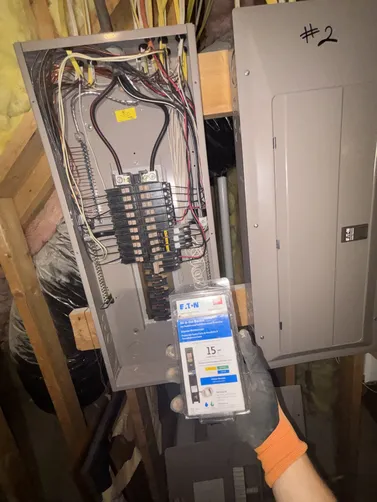 Installed a new 2-gang nail on box with 2 new duplex outlets. Installed a new 15A AFCI/GFCI Eaton CH breaker to supply our new outlets for the tankless water heater that was currently being installed.