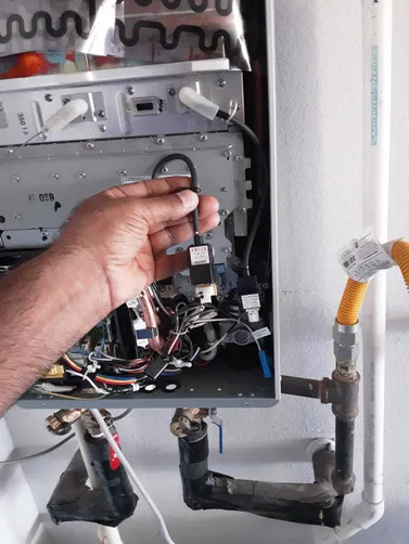 photo at Conroe, TX on Nov 12, 2025: The tankless water heater was not working due to an ignitor issue, which led to no spark. We diagno