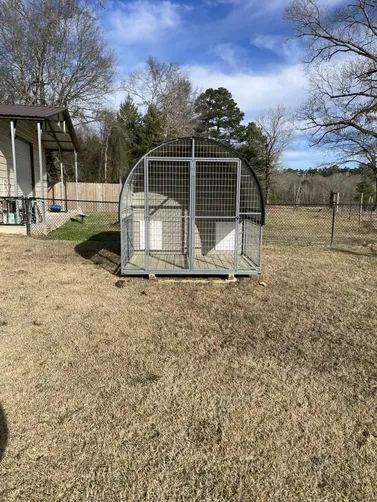photo at Diana, TX on Jan 13, 2026: 8x10 2 bay dog kennel in taupe with black trimKennel includes: welded steel frame, treated decking