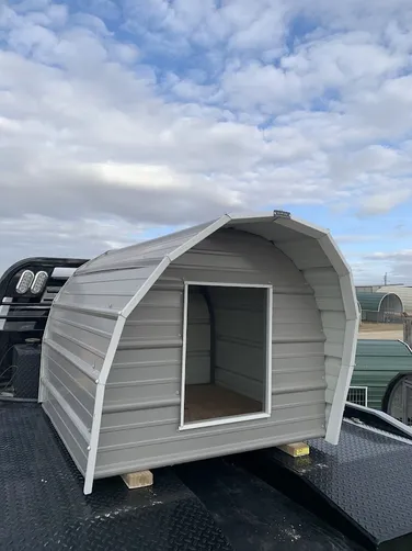 photo at Canton, TX on Jan 30, 2026: 4x4 dog house with solid floor, cutout on front wall, awning overpewter gray with white trimPick