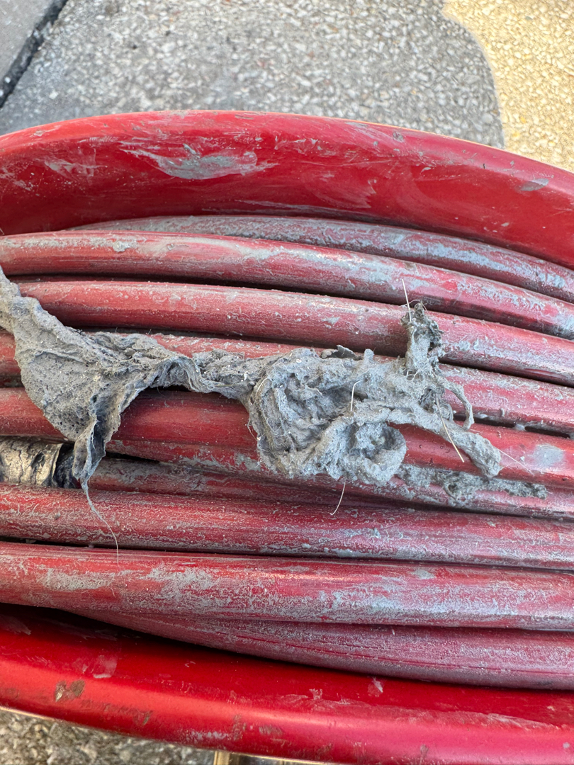 Drain cleaning equipment and debris removed from a drain in Elkhart, IN