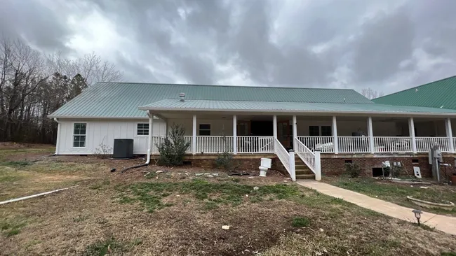 Customer is having the house remodeled and needed a roofing contractor who could work on a metal roof and install the flashing around the new exhaust vent.