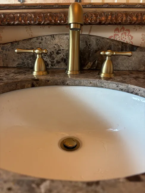 Installed a new widespread faucet, enhanced drainage, and upgraded stop valves for reliable plumbing performance.