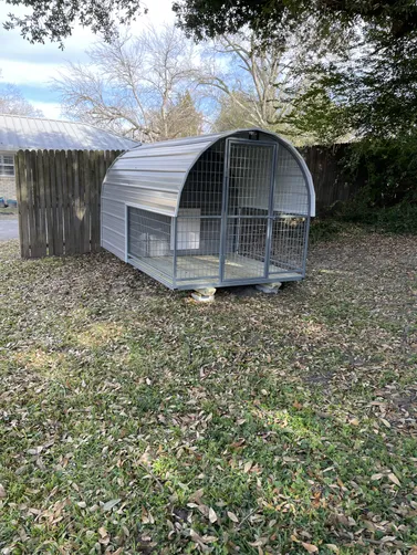 photo at Mineola, TX on Jan 13, 2026: 6x10 deluxe dog kennel in pewter gray with white trimfully enclosed back room includes: solid floo